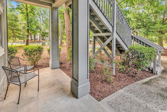 1221 Tidewater Dr Unit 911, North Myrtle Beach, SC 29582 - view of patio / terrace featuring stairway and view of wooded area