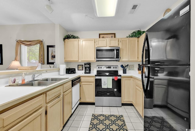 1221 Tidewater Dr Unit 911, North Myrtle Beach, SC 29582 - kitchen with appliances with stainless steel finishes, light brown cabinets, light countertops, and light tile patterned flooring