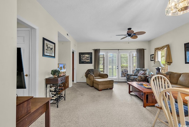 1221 Tidewater Dr Unit 911, North Myrtle Beach, SC 29582 - living area with light carpet, ceiling fan, and a textured ceiling
