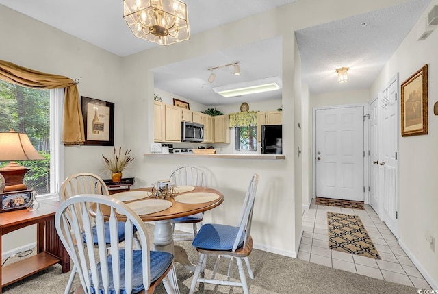 1221 Tidewater Dr Unit 911, North Myrtle Beach, SC 29582 - dining area with light tile patterned flooring and a chandelier