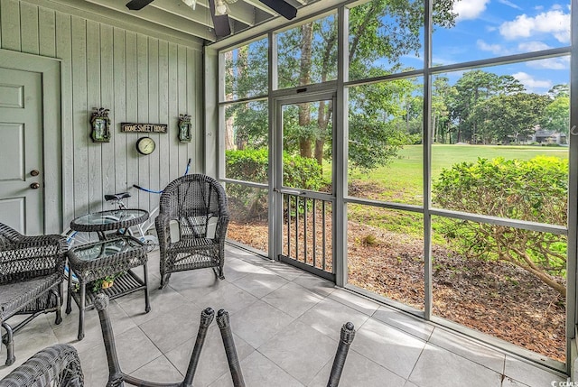 1221 Tidewater Dr Unit 911, North Myrtle Beach, SC 29582 - sunroom / solarium with ceiling fan and view of wooded area