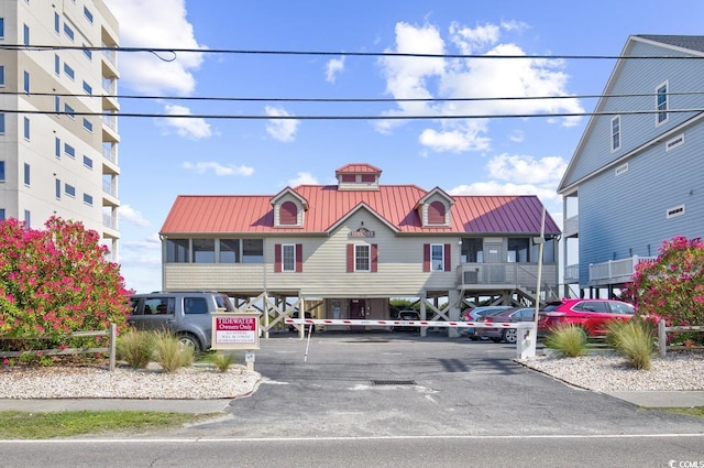 1221 Tidewater Dr Unit 911, North Myrtle Beach, SC 29582 - view of building exterior featuring covered and uncovered parking