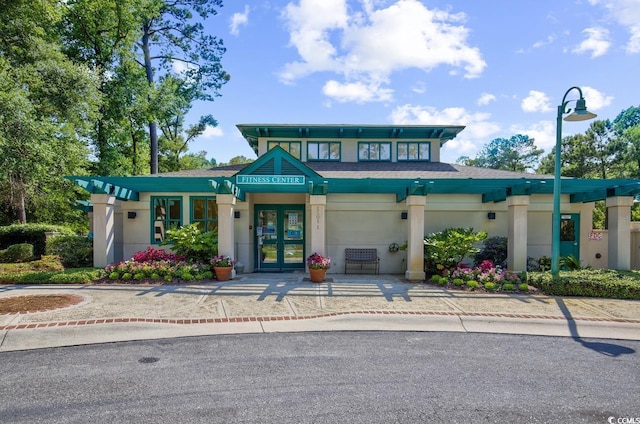 1221 Tidewater Dr Unit 911, North Myrtle Beach, SC 29582 - view of building exterior featuring a garage and driveway