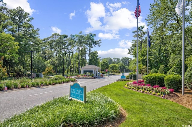 1221 Tidewater Dr Unit 911, North Myrtle Beach, SC 29582 - view of asphalt street with view of scattered trees