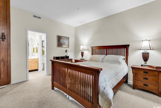 1221 Tidewater Dr Unit 911, North Myrtle Beach, SC 29582 - bedroom with light carpet and ensuite bathroom