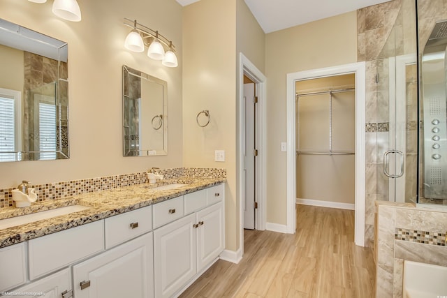2901 Whooping Crane Dr, North Myrtle Beach, SC 29582 - full bath with a stall shower, double vanity, wood finished floors, and a tub