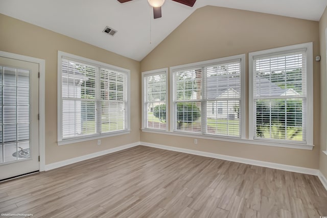 2901 Whooping Crane Dr, North Myrtle Beach, SC 29582 - unfurnished sunroom with lofted ceiling, wood finished floors, and a wooden deck