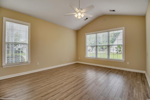 2901 Whooping Crane Dr, North Myrtle Beach, SC 29582 - empty room featuring a ceiling fan, light wood-style flooring, and vaulted ceiling