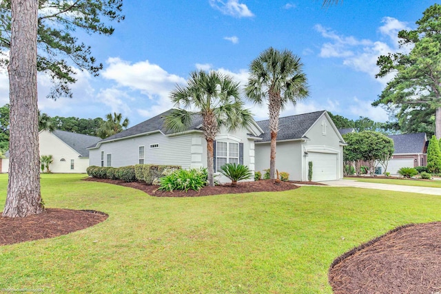 2901 Whooping Crane Dr, North Myrtle Beach, SC 29582 - view of front of house featuring driveway, a front yard, stucco siding, and a garage