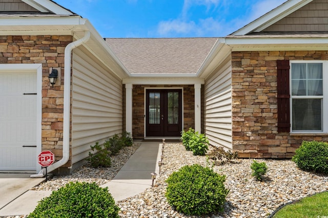 957 Bronwyn Cir N, Myrtle Beach, SC 29582 - entrance to property with french doors, stone siding, a shingled roof, and a garage