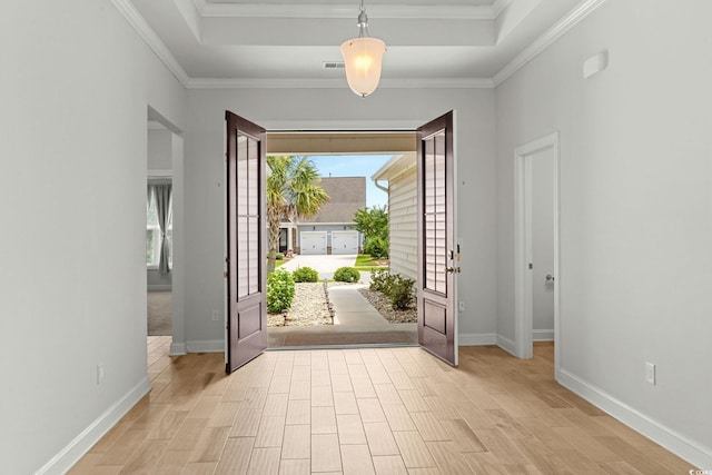 957 Bronwyn Cir N, Myrtle Beach, SC 29582 - foyer with a raised ceiling, light wood-type flooring, and crown molding