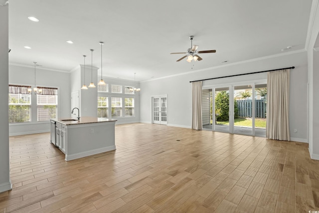 957 Bronwyn Cir N, Myrtle Beach, SC 29582 - unfurnished living room with a chandelier, a ceiling fan, plenty of natural light, recessed lighting, and ornamental molding
