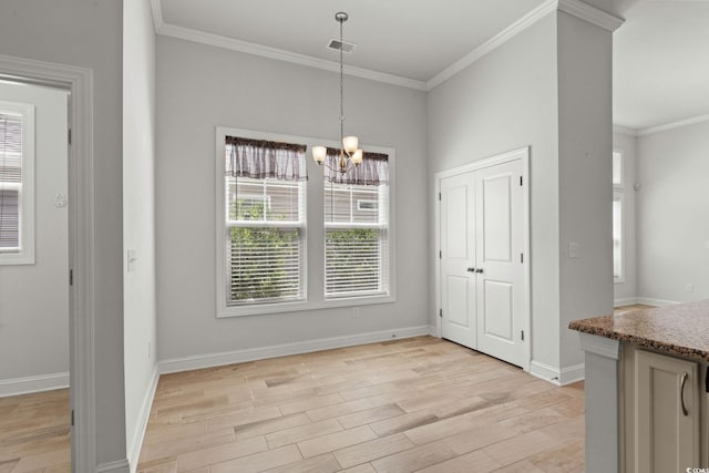957 Bronwyn Cir N, Myrtle Beach, SC 29582 - unfurnished dining area featuring crown molding, a chandelier, and light wood-type flooring