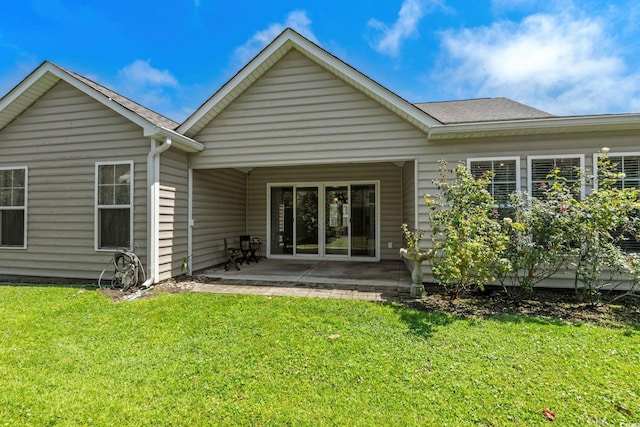 957 Bronwyn Cir N, Myrtle Beach, SC 29582 - rear view of property with a patio, a lawn, and roof with shingles