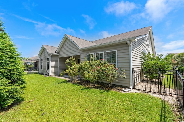 957 Bronwyn Cir N, Myrtle Beach, SC 29582 - view of property exterior with a gate and roof with shingles