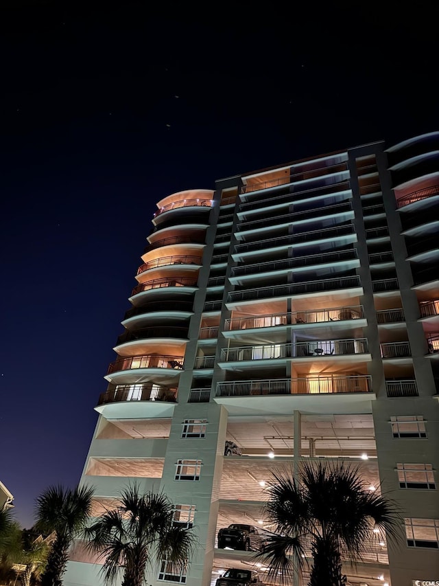 1401 S Ocean Blvd Unit 1307, North Myrtle Beach, SC 29582 - property at twilight featuring a view of apartment building / complex