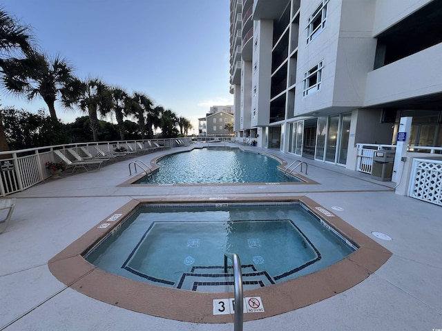 1401 S Ocean Blvd Unit 1307, North Myrtle Beach, SC 29582 - community pool with a community hot tub and a patio