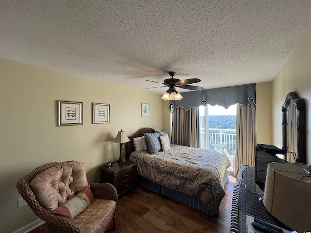 1401 S Ocean Blvd Unit 1307, North Myrtle Beach, SC 29582 - bedroom with dark wood-type flooring, a textured ceiling, a ceiling fan, and access to outside