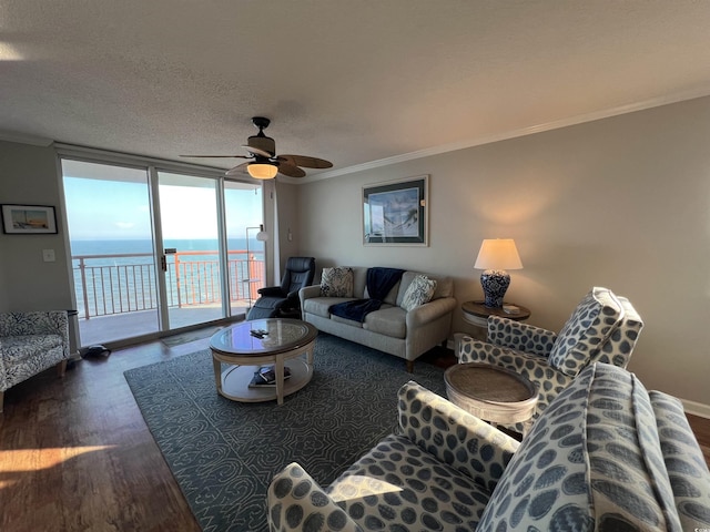 1401 S Ocean Blvd Unit 1307, North Myrtle Beach, SC 29582 - living room featuring ornamental molding, wood finished floors, expansive windows, ceiling fan, and a water view