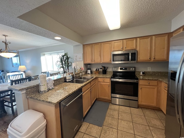 1401 S Ocean Blvd Unit 1307, North Myrtle Beach, SC 29582 - kitchen featuring appliances with stainless steel finishes, a textured ceiling, a peninsula, light tile patterned flooring, and hanging light fixtures