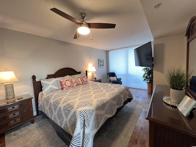 1401 S Ocean Blvd Unit 1307, North Myrtle Beach, SC 29582 - bedroom featuring a textured ceiling, wood finished floors, and ceiling fan