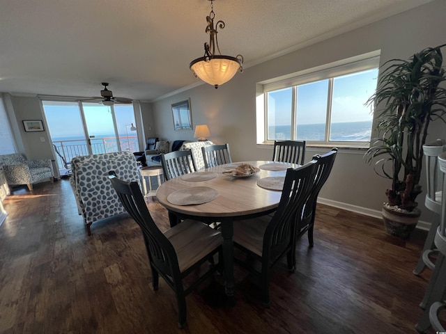 1401 S Ocean Blvd Unit 1307, North Myrtle Beach, SC 29582 - dining area featuring dark wood-type flooring, crown molding, a ceiling fan, and a water view