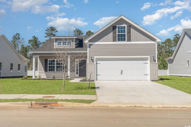 442 Lifestyle Ct, Surfside Beach, SC 29575 - craftsman house featuring brick siding, driveway, and a front lawn