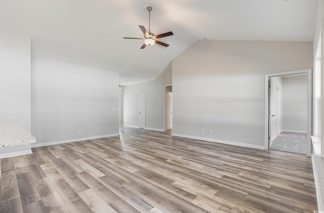 442 Lifestyle Ct, Surfside Beach, SC 29575 - empty room with ceiling fan, high vaulted ceiling, and wood finished floors