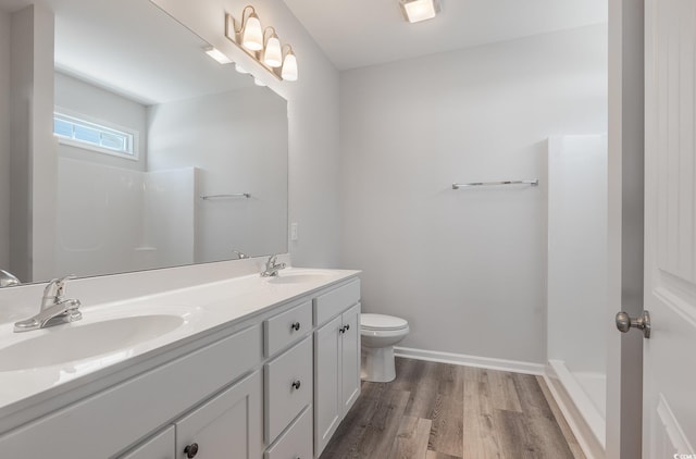 442 Lifestyle Ct, Surfside Beach, SC 29575 - bathroom featuring wood finished floors, double vanity, and a shower