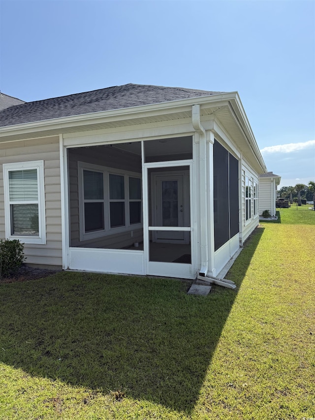 3085 Sistine St, Myrtle Beach, SC 29579 - view of side of property featuring a shingled roof, a yard, and a sunroom