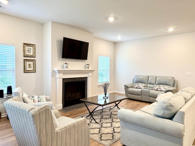 3085 Sistine St, Myrtle Beach, SC 29579 - living room with wood finished floors, plenty of natural light, a fireplace with flush hearth, and recessed lighting