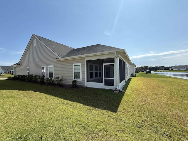 3085 Sistine St, Myrtle Beach, SC 29579 - back of house with a sunroom, a water view, a yard, and roof with shingles