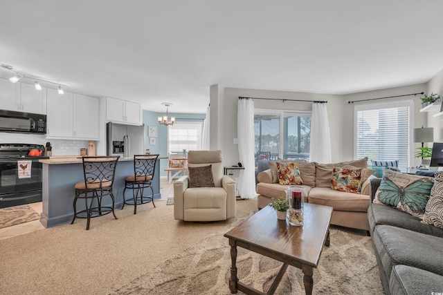 1500 Cenith Dr Unit E302, North Myrtle Beach, SC 29582 - living area featuring a chandelier and plenty of natural light
