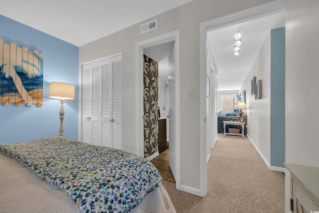 1500 Cenith Dr Unit E302, North Myrtle Beach, SC 29582 - carpeted bedroom featuring a closet and baseboards
