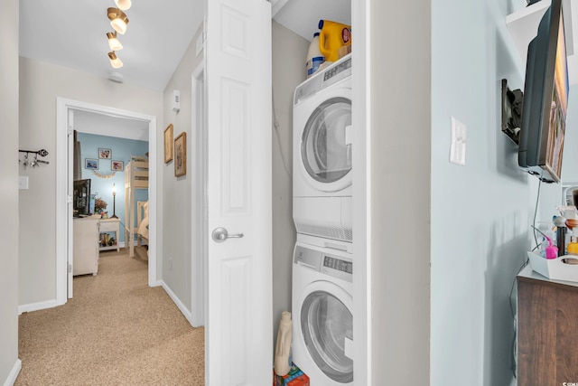 1500 Cenith Dr Unit E302, North Myrtle Beach, SC 29582 - washroom featuring stacked washer / dryer and light carpet