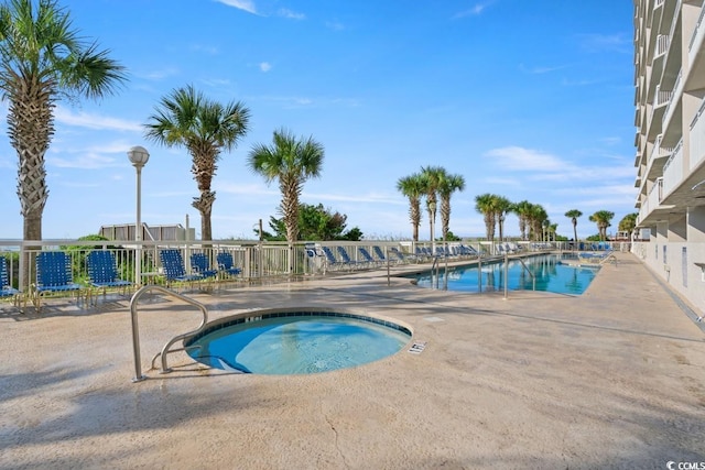 1625 S Ocean Blvd Unit 107, North Myrtle Beach, SC 29582 - community pool featuring a patio and a hot tub