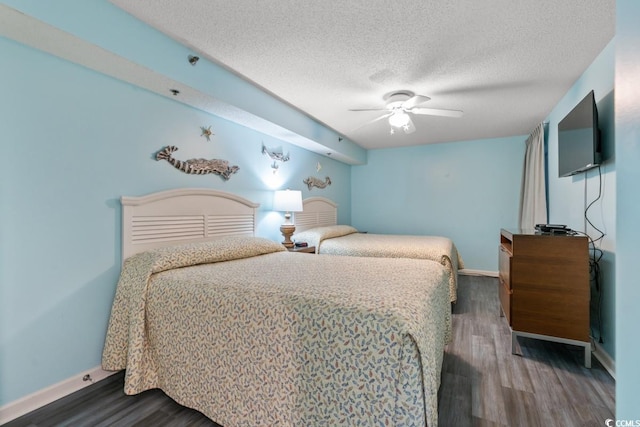 1625 S Ocean Blvd Unit 107, North Myrtle Beach, SC 29582 - bedroom featuring wood finished floors, a textured ceiling, and a ceiling fan