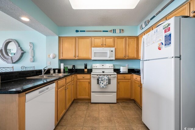 1625 S Ocean Blvd Unit 107, North Myrtle Beach, SC 29582 - kitchen with white appliances, a peninsula, and a textured ceiling