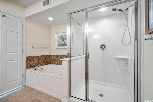 1625 S Ocean Blvd Unit 107, North Myrtle Beach, SC 29582 - bathroom with a shower stall, a bath, and tile patterned floors