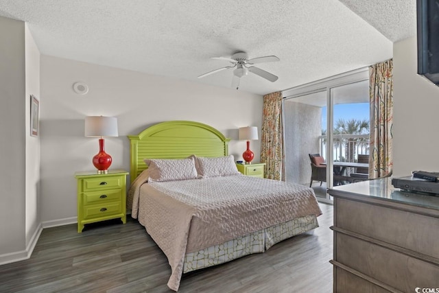 1625 S Ocean Blvd Unit 107, North Myrtle Beach, SC 29582 - bedroom with access to outside, wood finished floors, a textured ceiling, a wall of windows, and ceiling fan