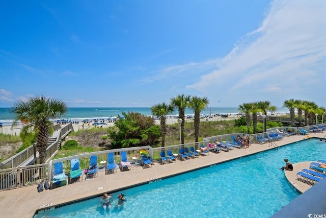 1625 S Ocean Blvd Unit 107, North Myrtle Beach, SC 29582 - community pool with view of water and beach and a patio