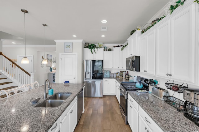 2766 Stellar Loop, Myrtle Beach, SC 29577 - kitchen featuring stainless steel appliances, ornamental molding, white cabinets, decorative light fixtures, and dark wood-style flooring
