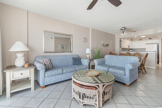102 N Ocean Blvd Unit 508, North Myrtle Beach, SC 29582 - living area featuring ceiling fan, light tile patterned floors, and a textured ceiling