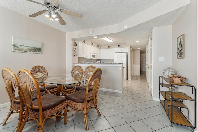102 N Ocean Blvd Unit 508, North Myrtle Beach, SC 29582 - dining area featuring light tile patterned flooring, a textured ceiling, and ceiling fan