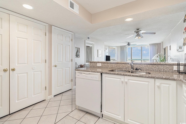 102 N Ocean Blvd Unit 508, North Myrtle Beach, SC 29582 - kitchen with dishwasher, white cabinets, ceiling fan, light tile patterned floors, and a textured ceiling