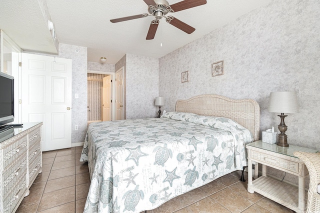 102 N Ocean Blvd Unit 508, North Myrtle Beach, SC 29582 - tiled bedroom with wallpapered walls, a ceiling fan, and a textured ceiling