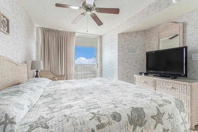 102 N Ocean Blvd Unit 508, North Myrtle Beach, SC 29582 - bedroom featuring access to outside, a textured ceiling, ceiling fan, and a textured wall