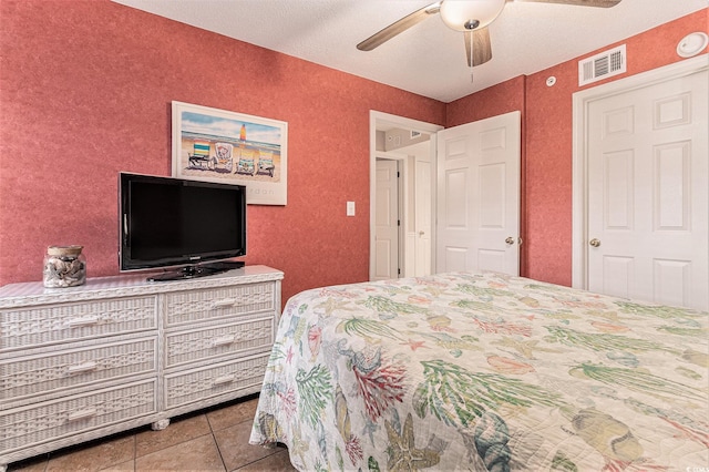 102 N Ocean Blvd Unit 508, North Myrtle Beach, SC 29582 - tiled bedroom with ceiling fan and a textured wall