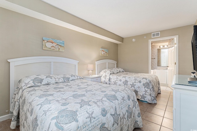 102 N Ocean Blvd Unit 508, North Myrtle Beach, SC 29582 - bedroom with light tile patterned flooring and ensuite bath