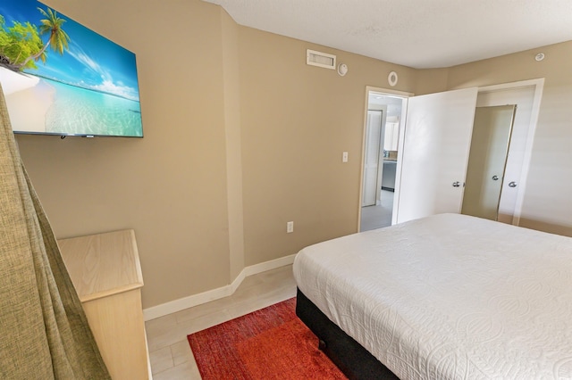2000 N Ocean Blvd Unit 1117, Myrtle Beach, SC 29577 - bedroom featuring light tile patterned floors and baseboards